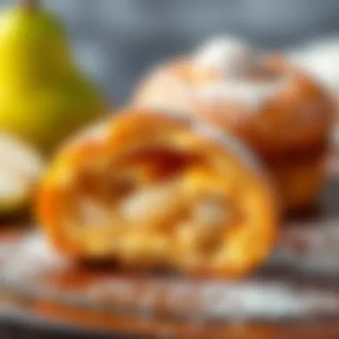 A close-up of a pear puff cut in half to reveal its delightful interior and texture.